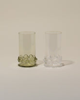 Bollenglass Design Green Dot Highball Glass and Clear Dot Highball Glass on light color background.