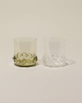 Bollenglass Design Clear Dot Whiskey Glass and Green Dot Whiskey Glass on light color background.