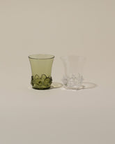 Bollenglass Design Clear Liquor Glass and Green Liquor Glass on light color background.