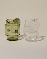 Bollenglass Design Green Petite Pitcher and Bollenglass Design Clear Petite Pitcher on light color background.