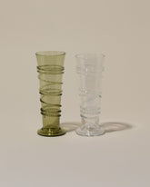 Bollenglass Design Green Petite Spiral Tumbler and Clear Petite Spiral Tumbler on light color background.