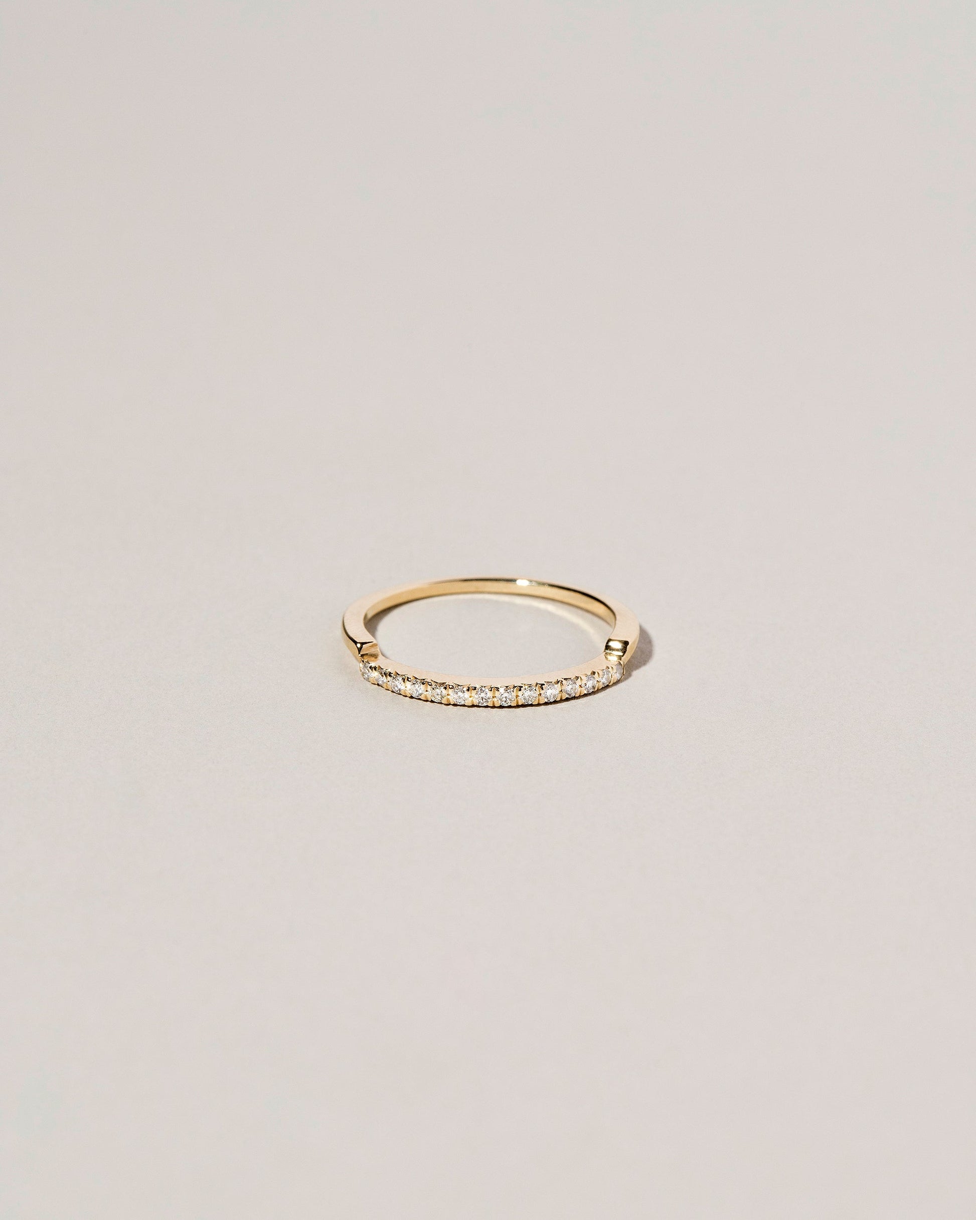 Gold Notched Band on light color background.