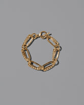 CRZM 22k Gold Ophiolite Bracelet on light color background.
