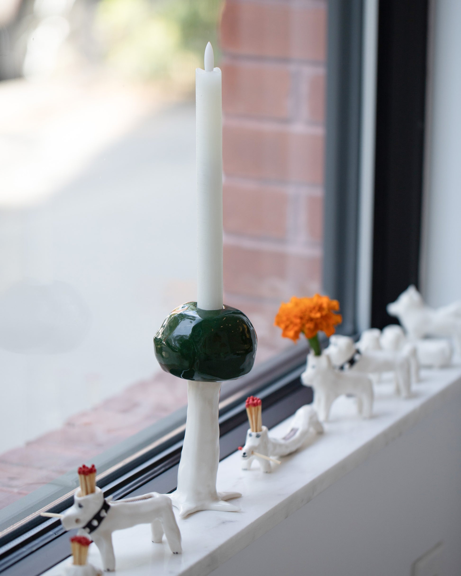 Styled Image of the Eleonor Boström Dark Green PARK Candlestick Tree. Candle not included.