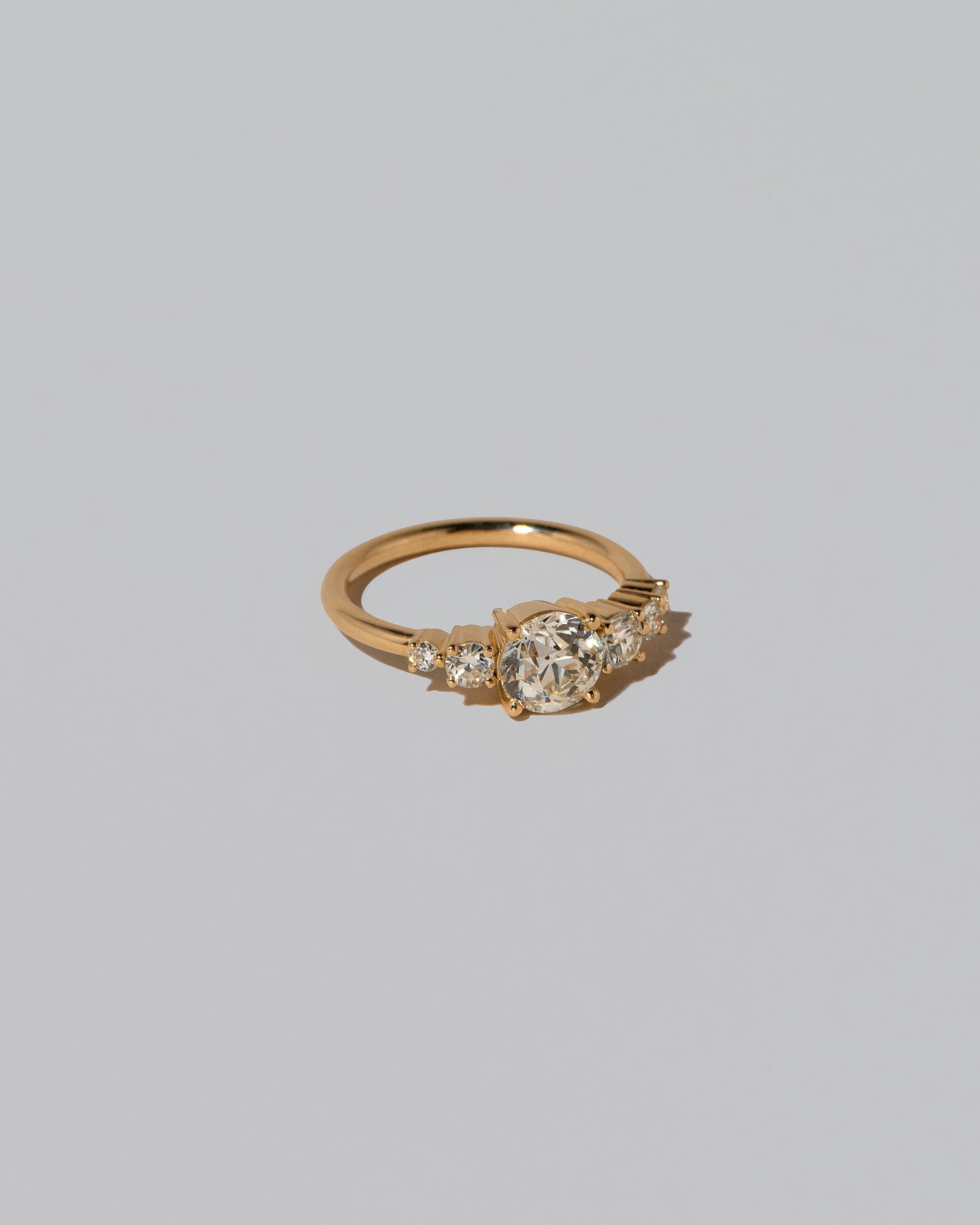 View from the side of the White Diamond Capella Ring on light color background.