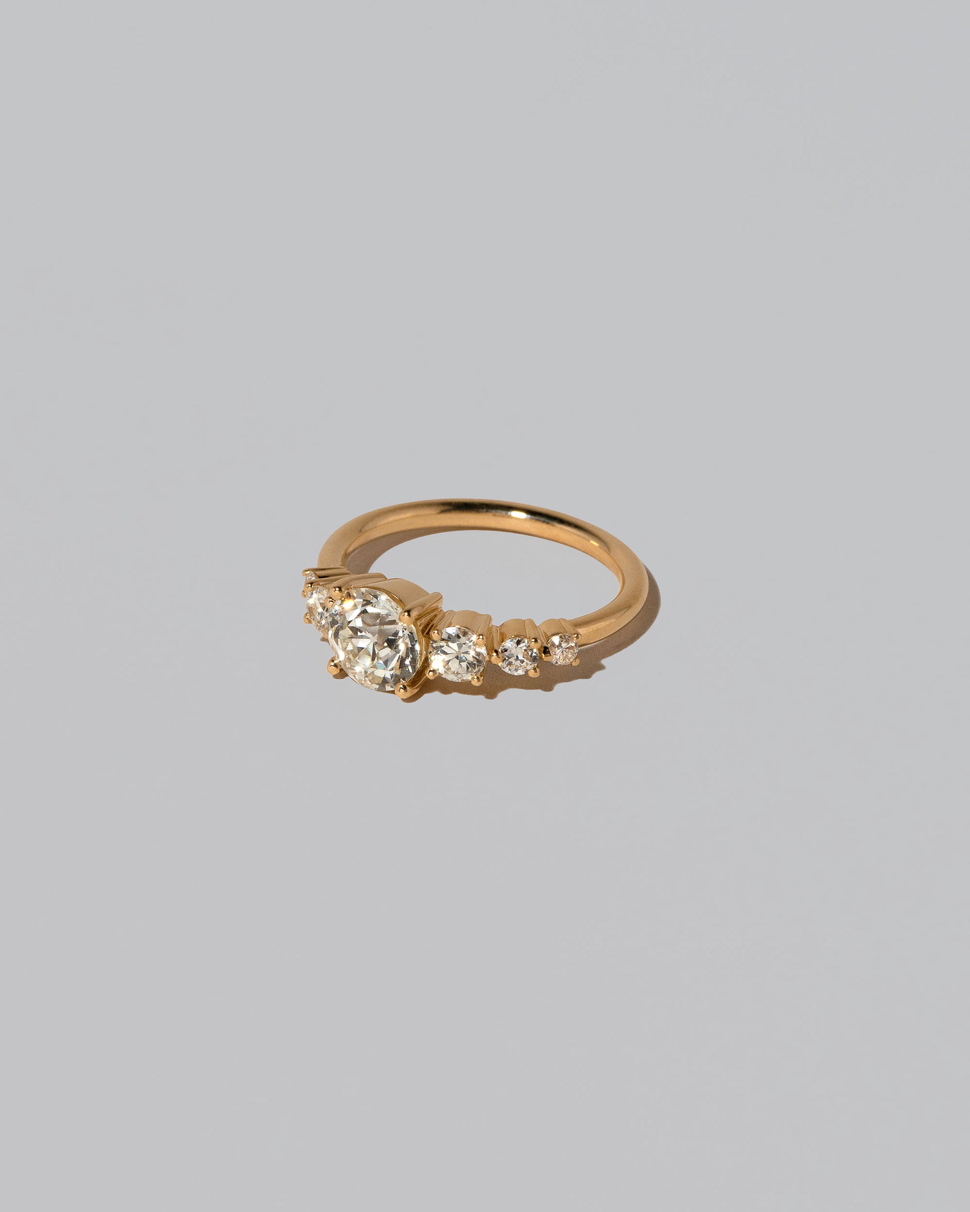 View from the side of the White Diamond Capella Ring on light color background.