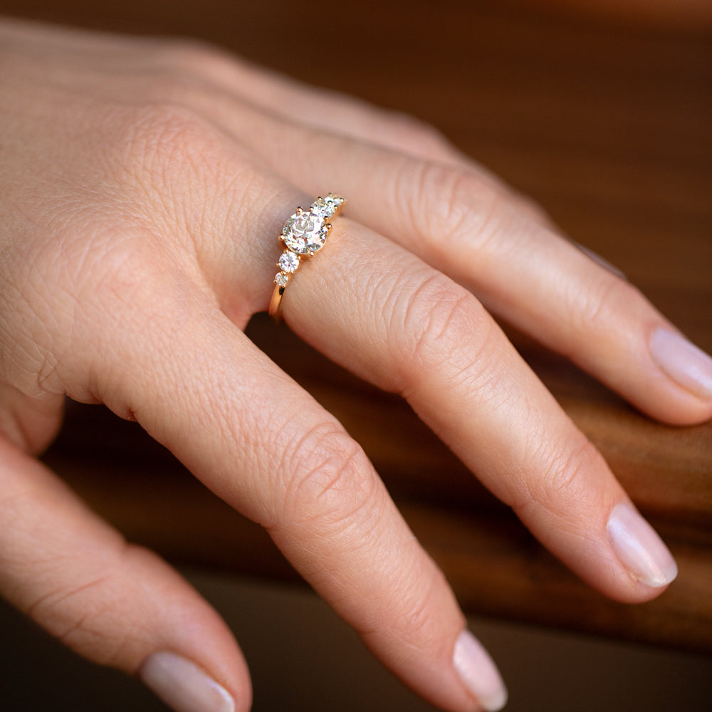 product_details::White Diamond Capella Ring on model.