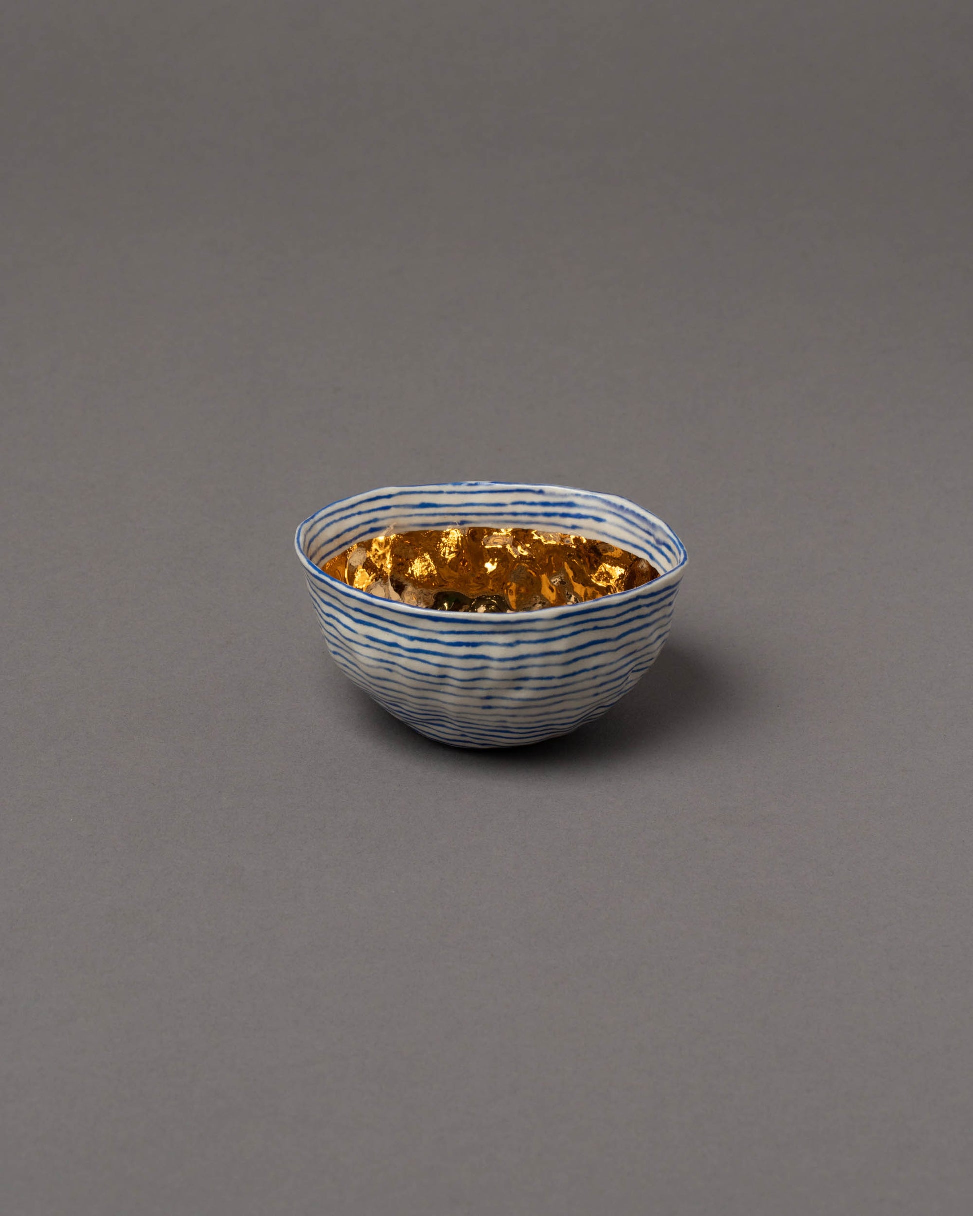 Suzanne Sullivan Minimizes Interference Considering Utility Royal Bowl on grey color background.