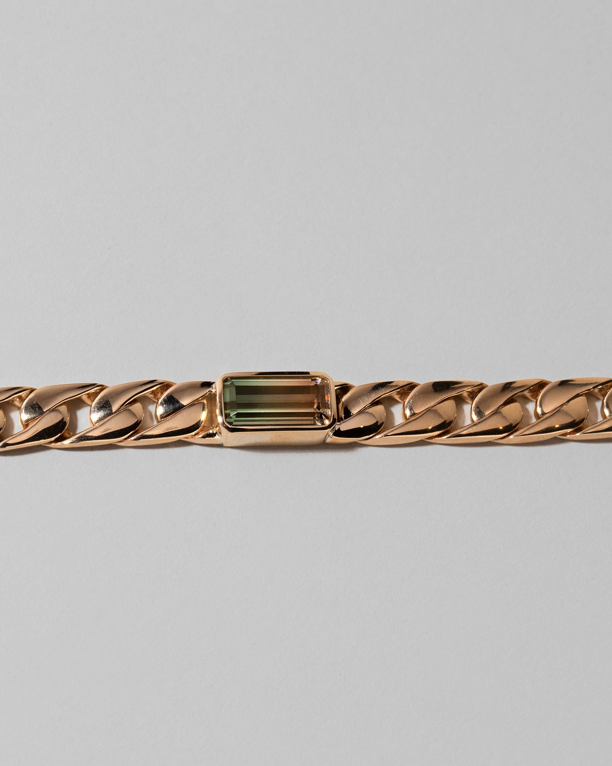 Closeup details of the Identity Chain Bicolor Tourmaline Bracelet 003 on light color background.