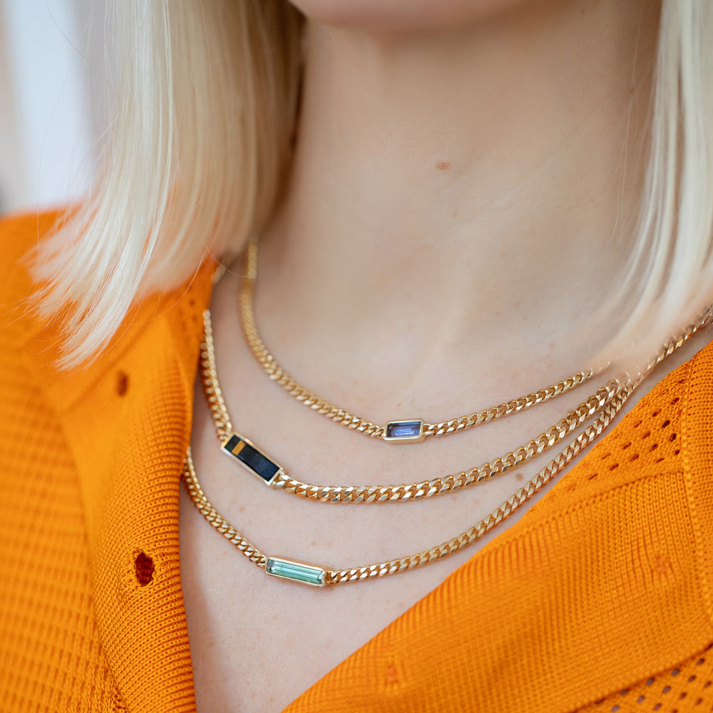 product_details::Serenity Necklace, Generosity Necklace and Lucid Thinking Necklace on model.