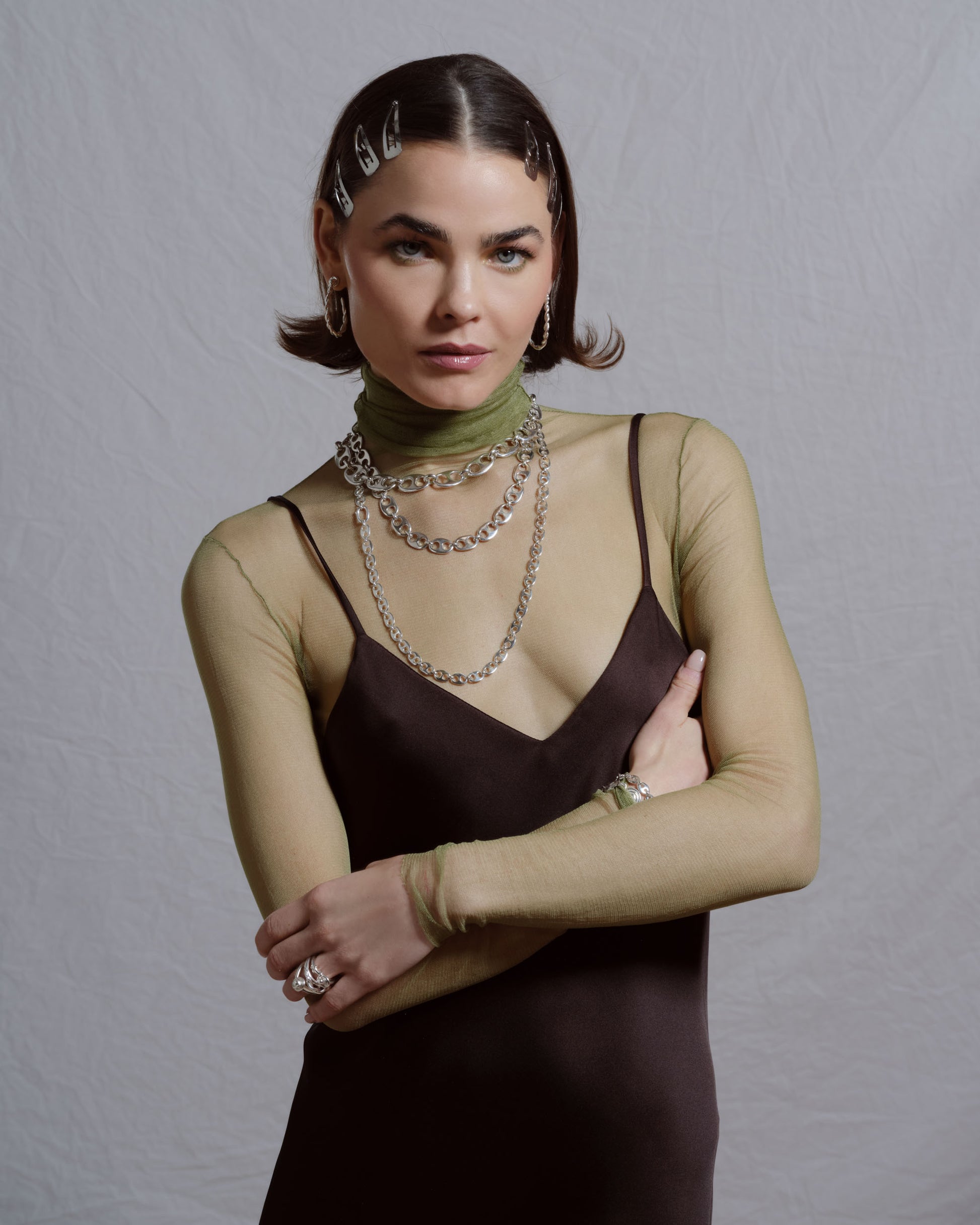Styled image featuring CRZM jewelry on model.