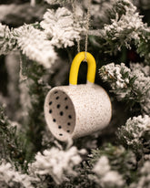 Styled image of the Recreation Center Dot Mug Ornament.