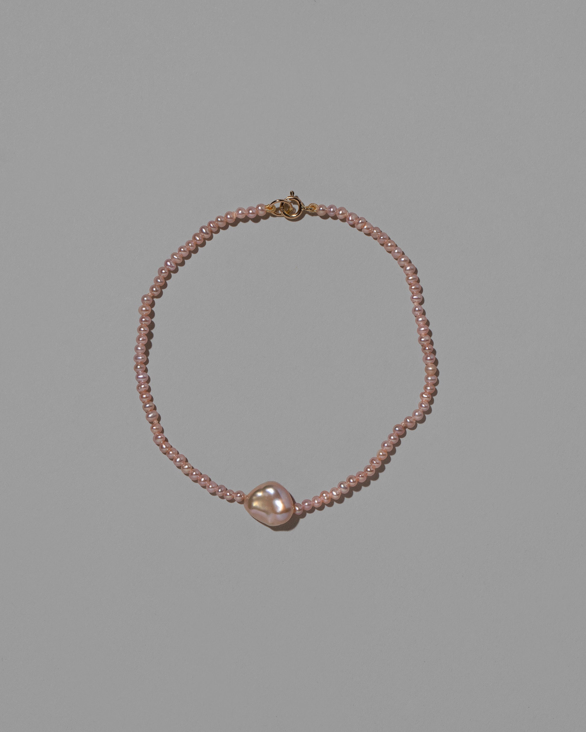 Siren Pink Lagniappe Bracelet on light color background.