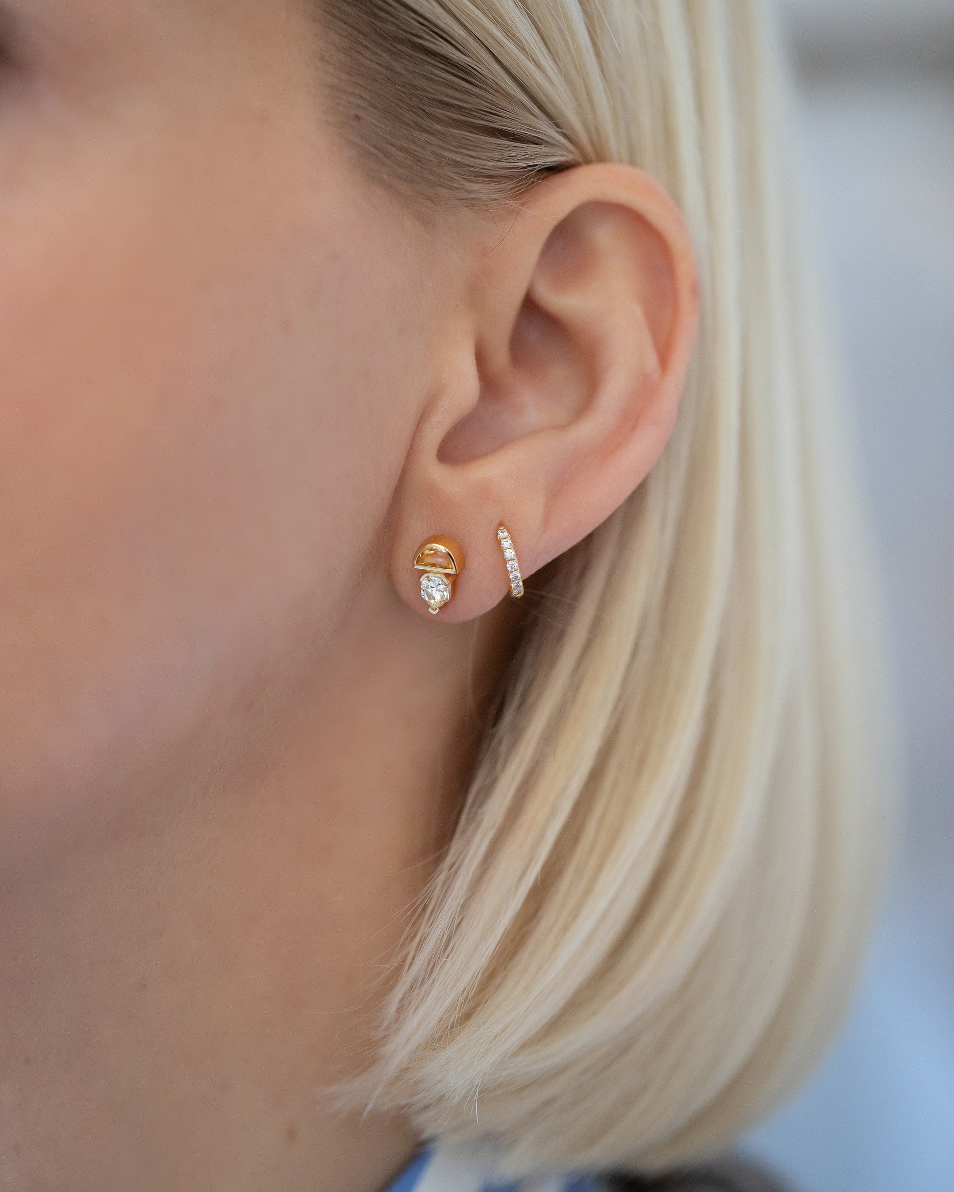 Delphinus Earrings on model.