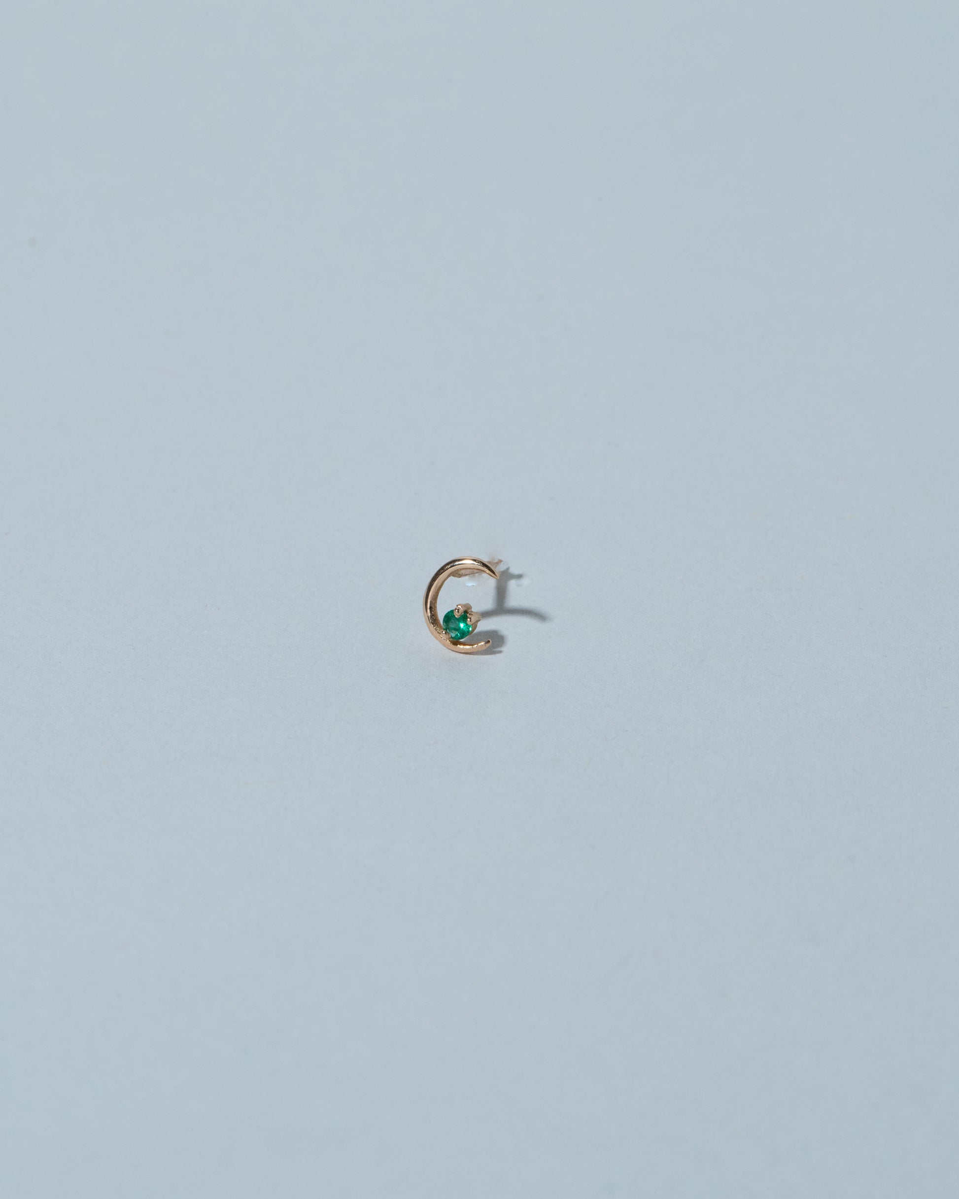 Samples & Imperfects 18k Rose Gold Emerald Moon Ray Stud Earring Single on light color background.