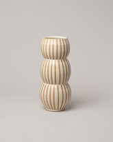 Jeremy Ayers White Striped Bubble Vase on light color background.