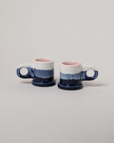 Echo Park Pottery by Peter Shire White & Navy Double Dip Espresso Mug Set on light color background.