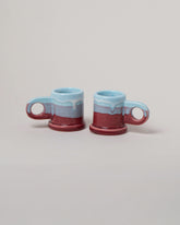 Echo Park Pottery by Peter Shire Baby Blue & Ruby Double Dip Espresso Mug Set on light color background.