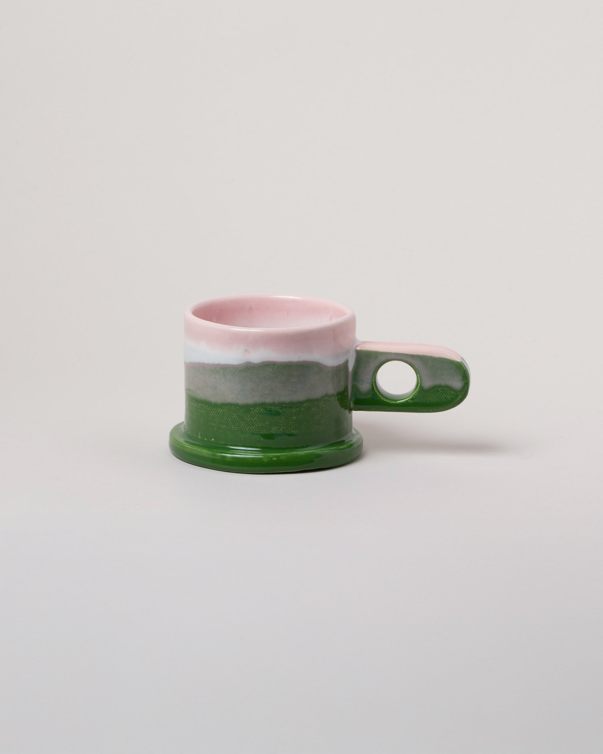 Echo Park Pottery by Peter Shire Pink & Green Double Dip Mug on light color background.