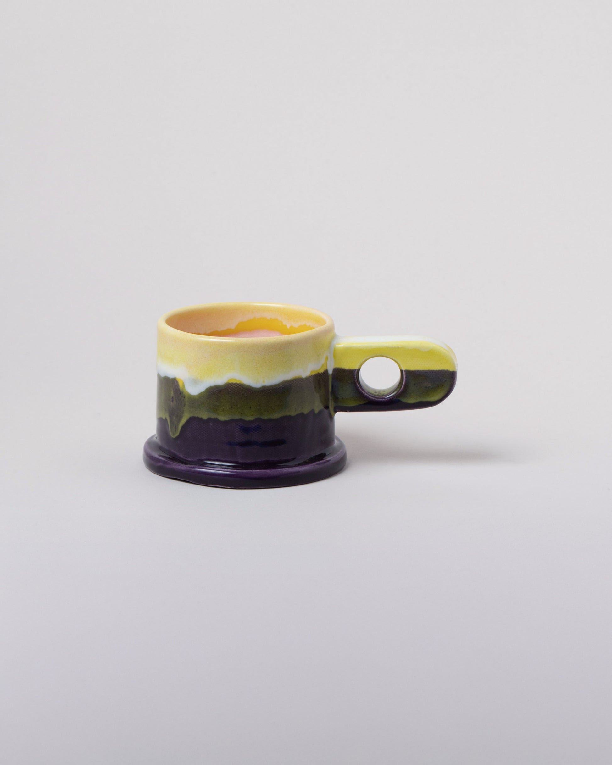 Echo Park Pottery by Peter Shire Yellow & Plum Double Dip Mug on light color background.