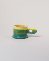 Echo Park Pottery by Peter Shire Yellow & Green Double Dip Mug on light color background.