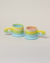 Echo Park Pottery by Peter Shire Lime & Baby Blue Double Dip Mug Set on light color background.