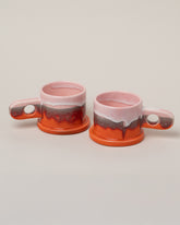 Echo Park Pottery by Peter Shire Pink & Orange Double Dip Mug Set on light color background.