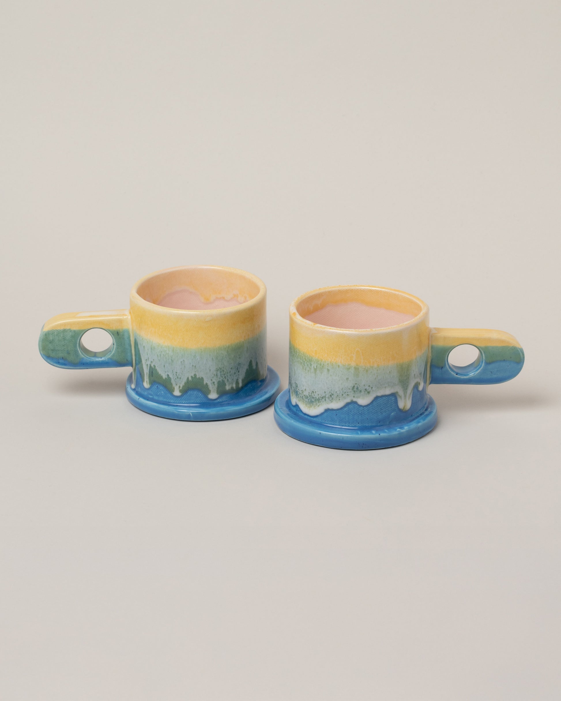 Echo Park Pottery by Peter Shire Yellow & Blue Double Dip Mug Set on light color background.