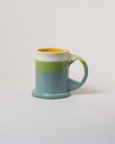 Echo Park Pottery by Peter Shire Lime & Seafoam Large Double Dip Mug on light color background.