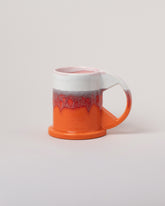 Echo Park Pottery by Peter Shire White & Orange Large Double Dip Mug on light color background.