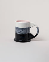 Echo Park Pottery by Peter Shire White, Gray and Black Large Double Dip Mug on light color background.