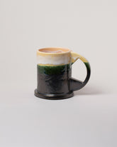 Yellow & Black Large Double Dip Mug on light color background.