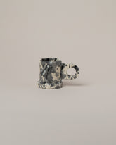 Echo Park Pottery by Peter Shire Black Splatter Espresso Mug on light color background.