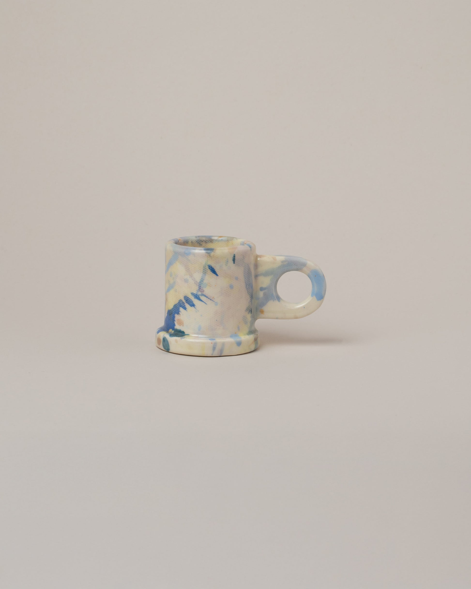Echo Park Pottery by Peter Shire Blue Splatter Espresso Mug on light color background.