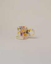 Echo Park Pottery by Peter Shire Blue & Yellow Splatter Espresso Mug on light color background.