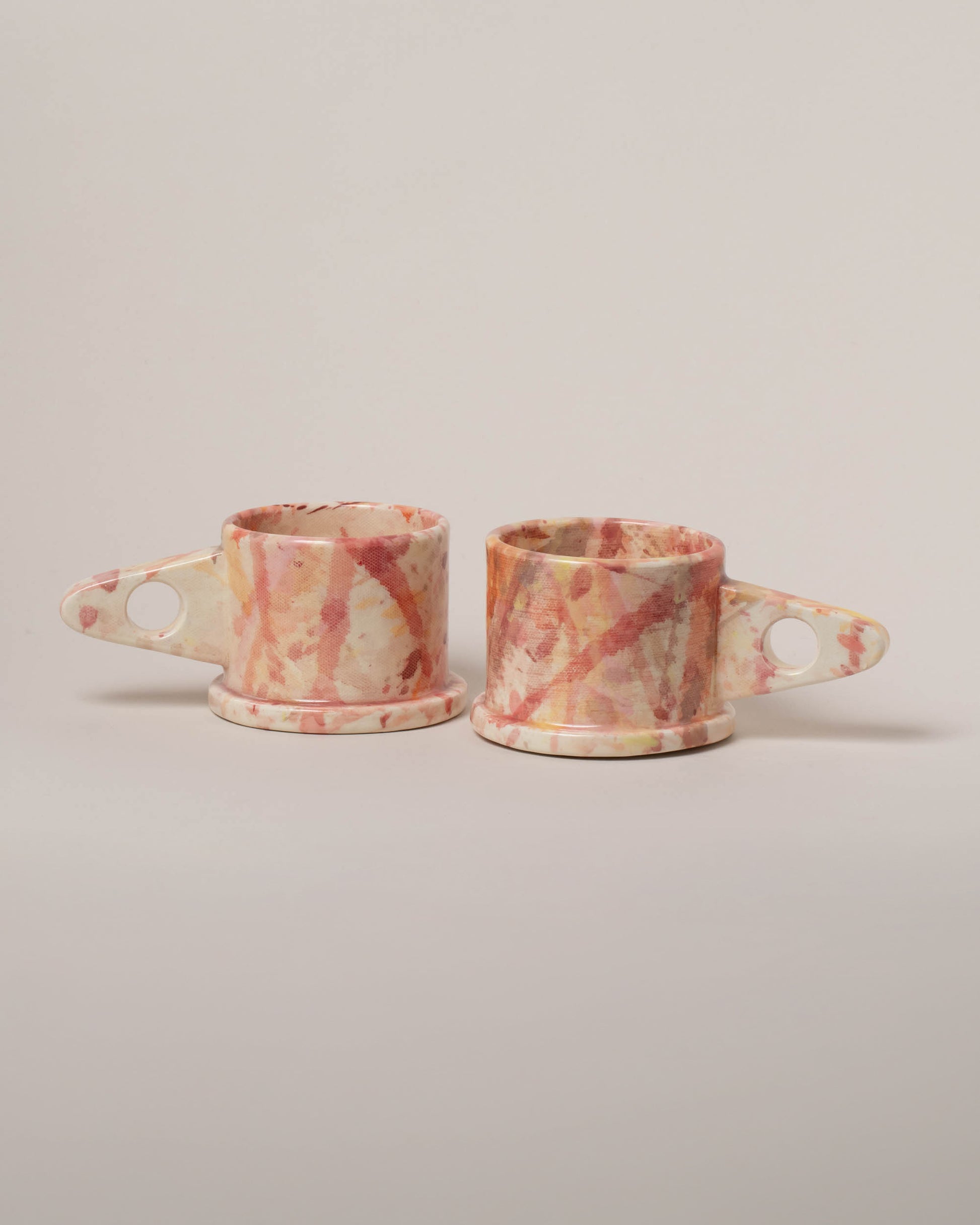 Echo Park Pottery by Peter Shire Rose Splatter Mug Set on light color background.