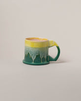 Echo Park Pottery by Peter Shire Yellow & Green XL Double Dip Mug on light color background.