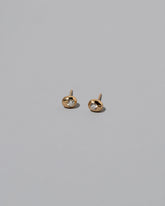 Yellow Gold Diamond Level Stud Earrings on light color background