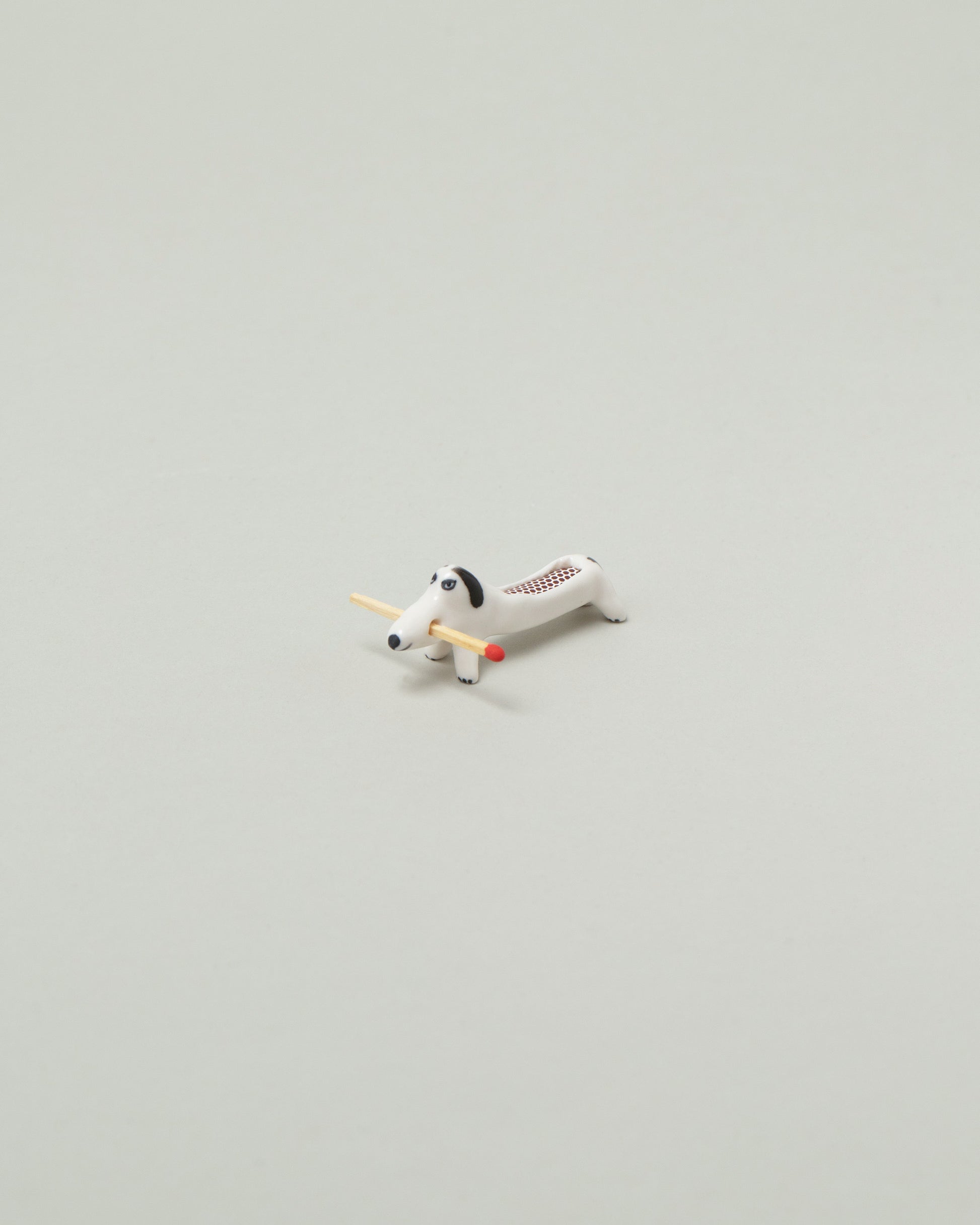 Eleonor Boström Mini Matchstick Dog on light color background.