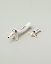 Eleonor Boström Mini Matchstick Dog and Black Matchstick Dog on light color background.