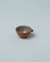 Emris Brick Clay Teenie Bowl on light color background.