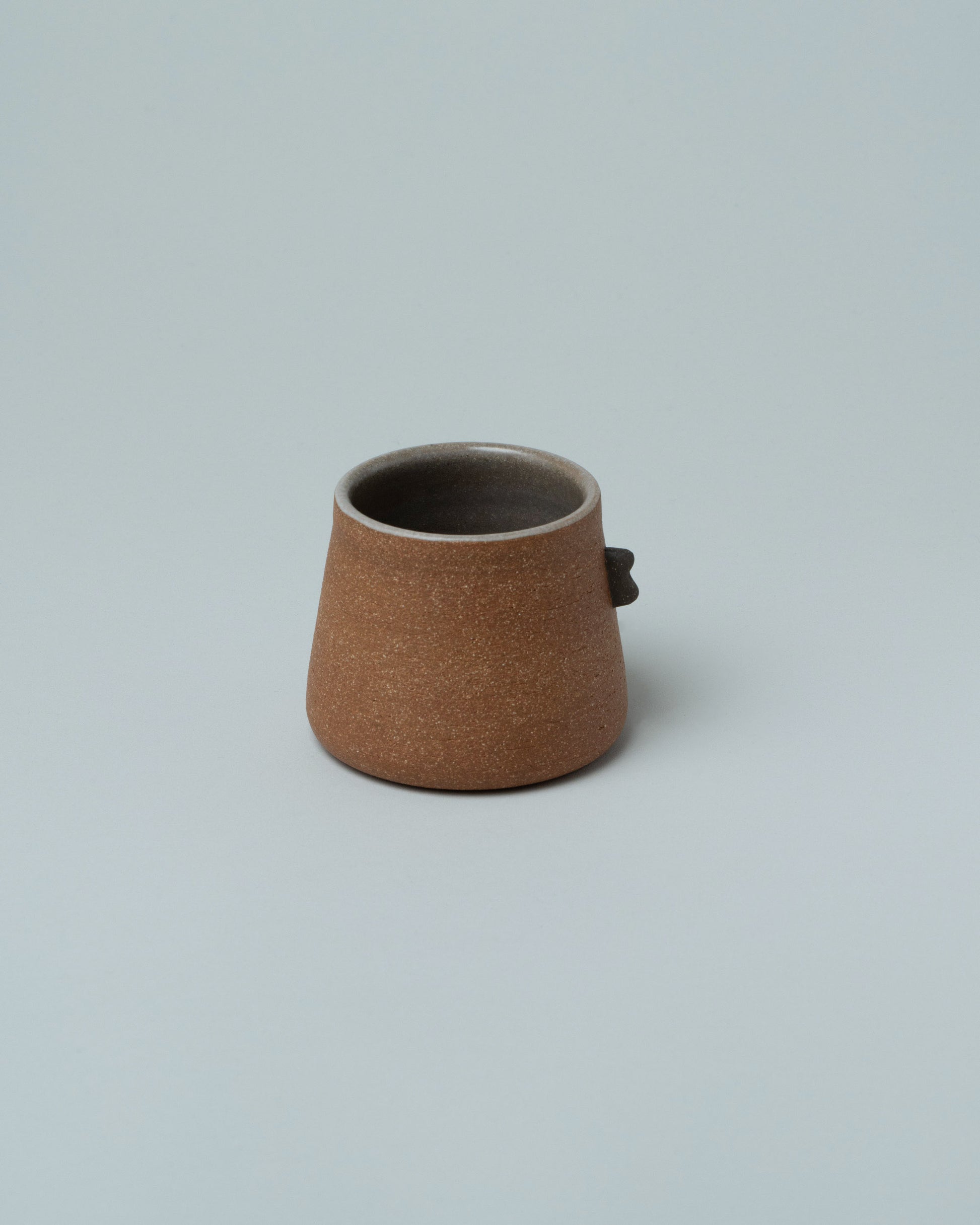 Emris Brick Clay Nub Cup on light color background.