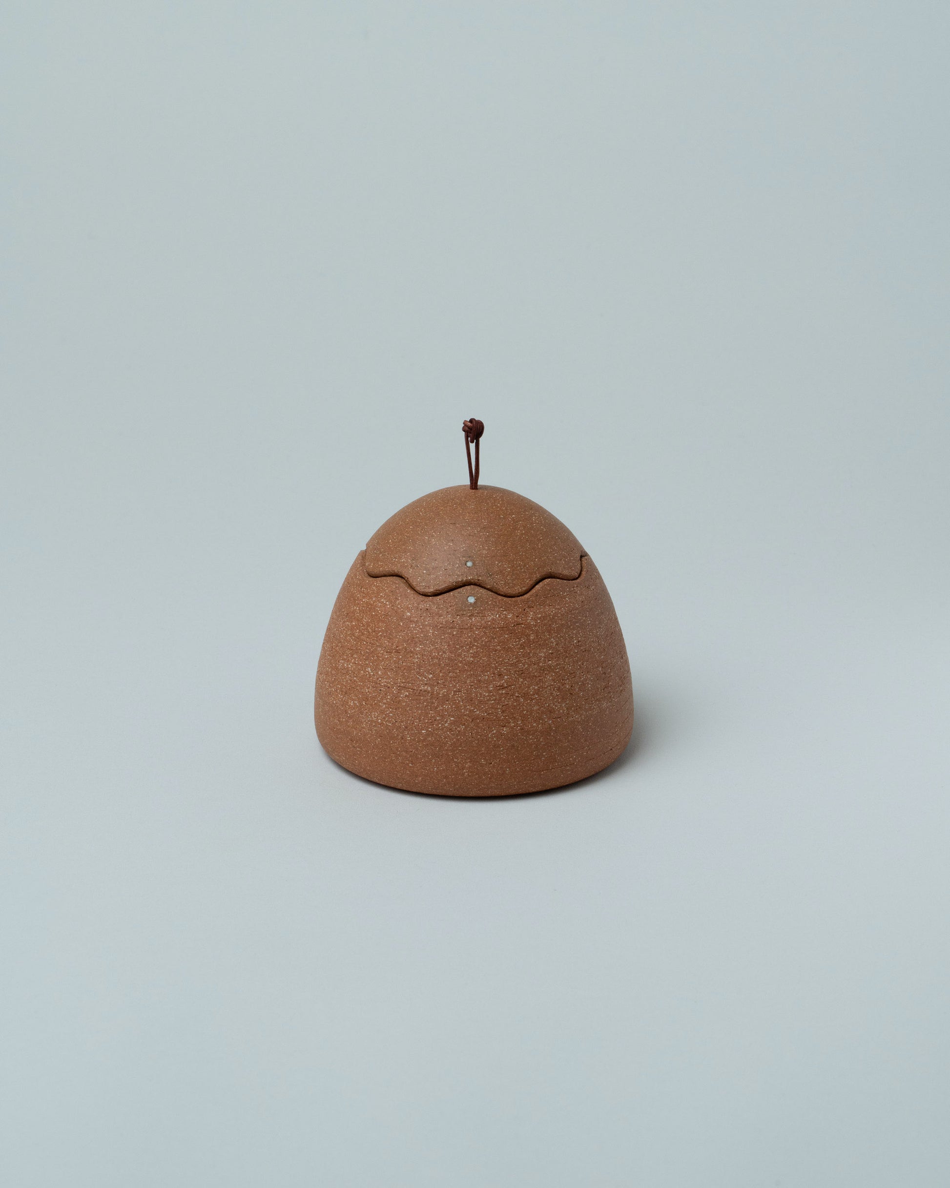 Emris Brick Clay Squiggle Jar on light color background.