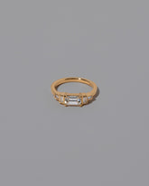 Gold Diamond Expression Ring on light color background.