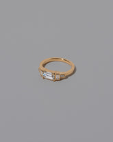 View from the side of the Gold Diamond Expression Ring on light color background.