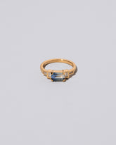 Blue Sapphire Expression Ring on light color background.