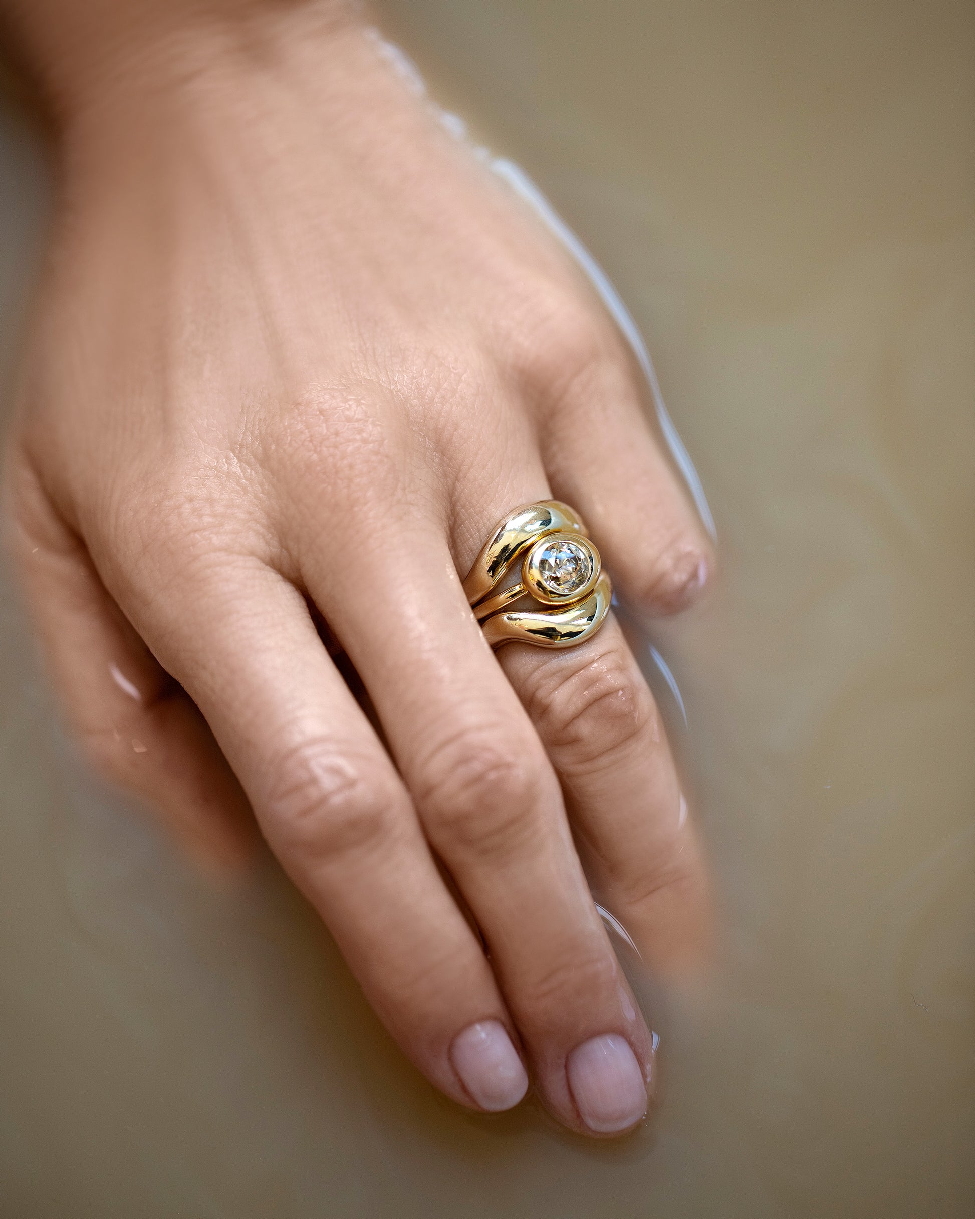 Gold Wide Planate Band, Diamond Grand Level Ring and Gold Unbroken Band on model.