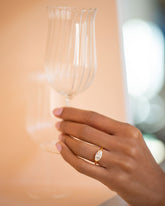 Styled image featuring the Sophie Lou Jacobsen Tulip Wine Glass and Vivacity Ring.