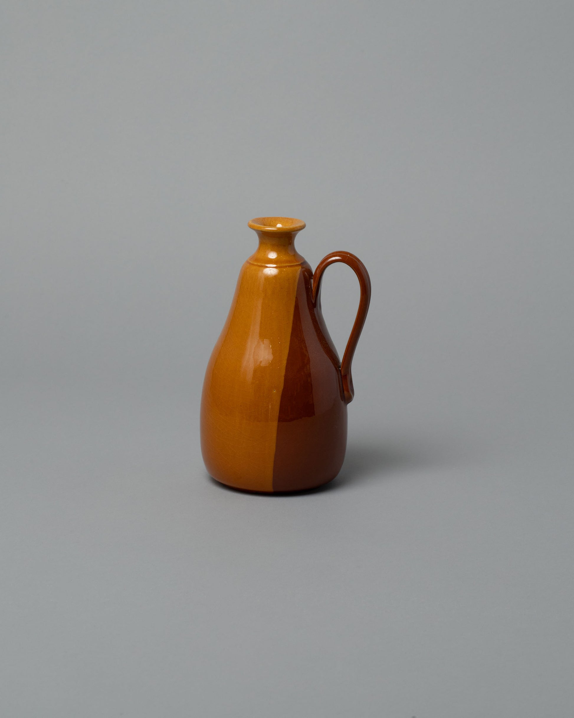 La Ceramica Vincenzo Del Monaco Caramel Samples & Imperfects Oil Bottle on light color background.