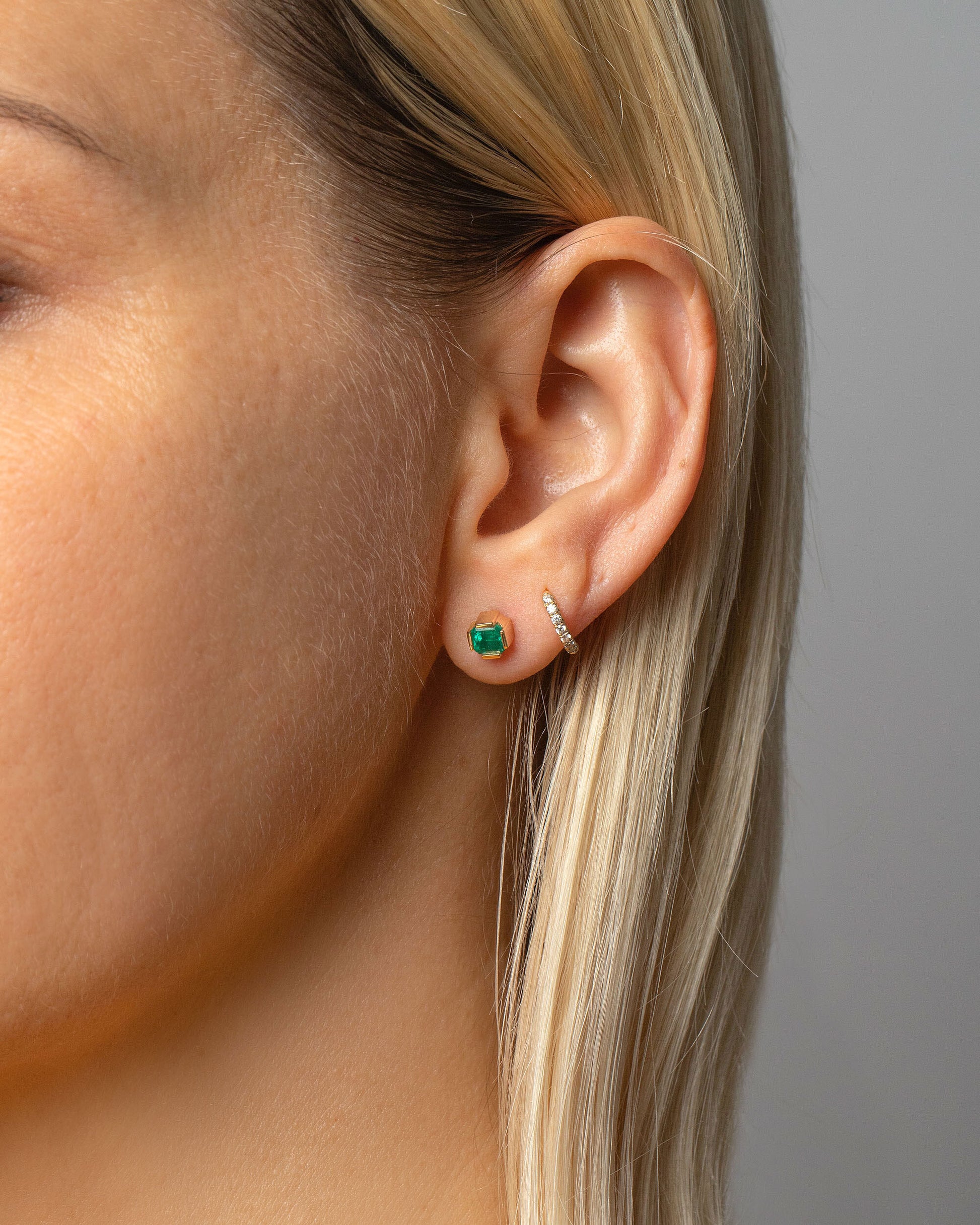 Emerald Fold Earrings on model.